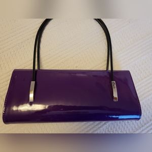 Purple patent leather clutch with handles